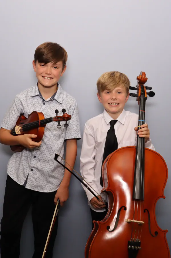 Two boys with a violin and a cello